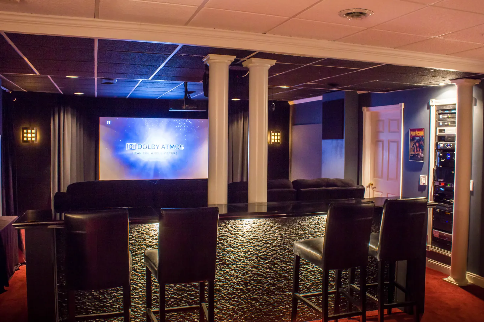 A successful home theater is a room-design project before it is an equipment purchase. Sightlines, acoustics, speaker geometry, ventilation and control determine whether premium components perform well.